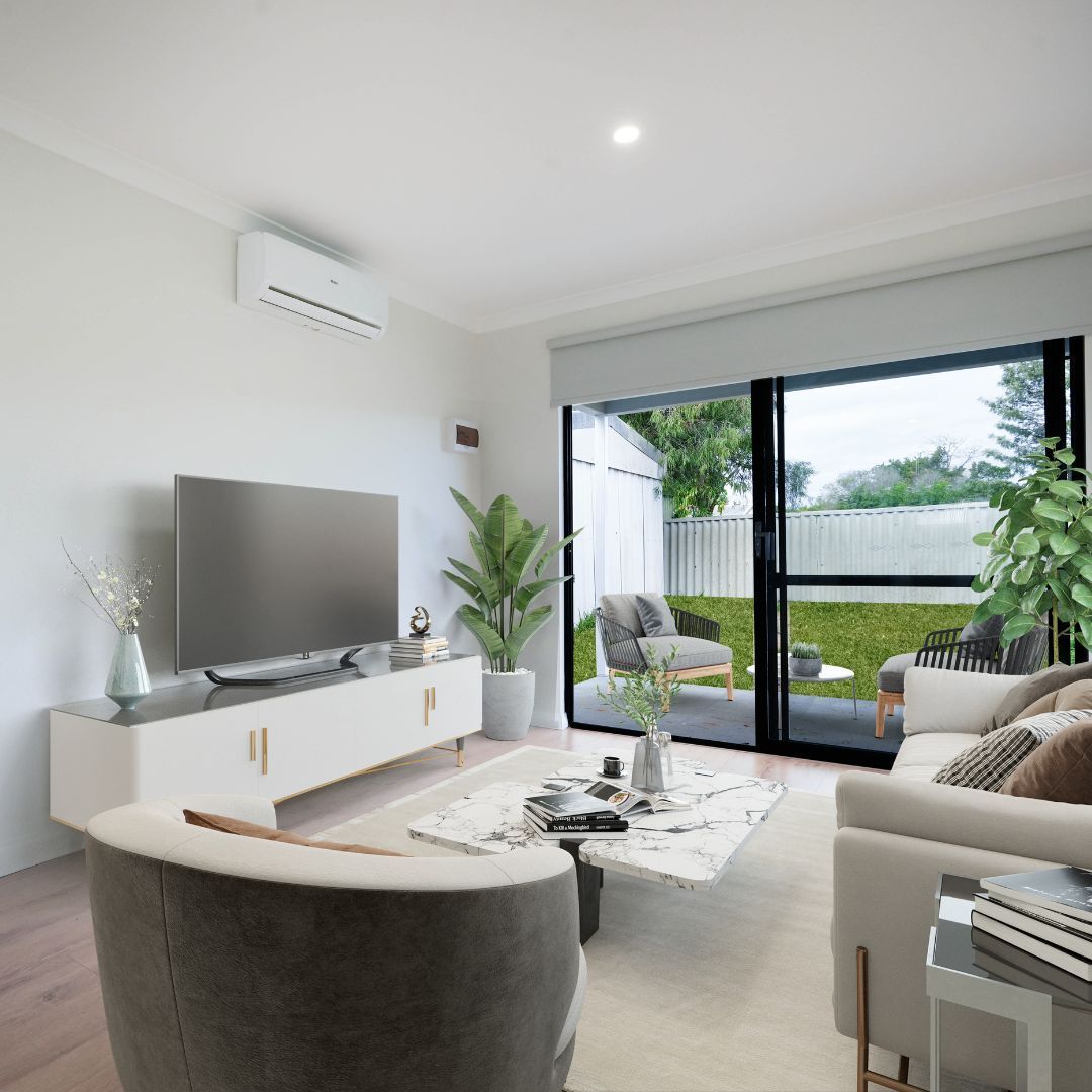 A modern living room with a TV, white media console, sofa, armchair, marble coffee table, and a sliding door to a yard.