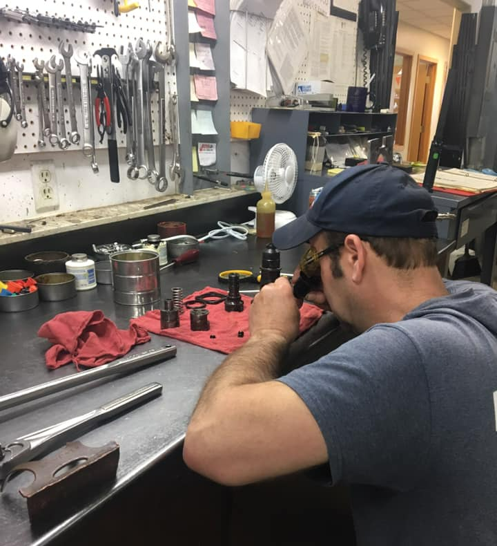 Professional Mechanic Testing Diesel Injector - Bellingham, WA - Northland Diesel Service Professional Mechanic Testing Diesel Injector - Bellingham, WA - Northland Diesel Service