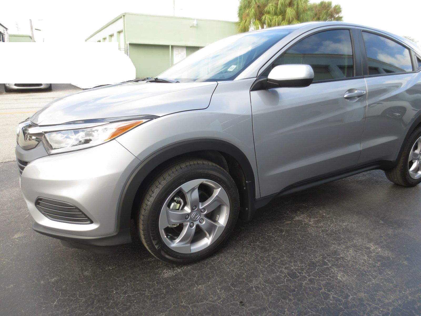 A silver honda hrv is parked in a parking lot | B & R Auto Body Works