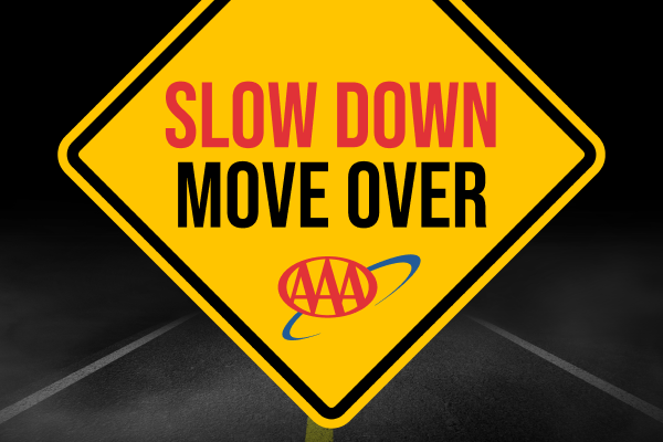 Yellow road sign reading “SLOW DOWN MOVE OVER” with AAA logo on a dark background | Jeff's Automotive, Inc