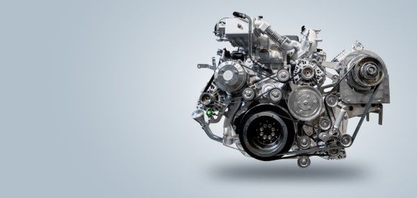 Detailed metallic car engine isolated on a light background | Jeff's Automotive, Inc