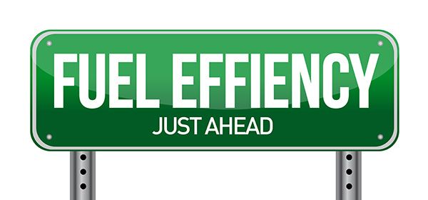 Green highway sign reading “FUEL EFFICIENCY” with “JUST AHEAD” below. | Jeff's Automotive, Inc