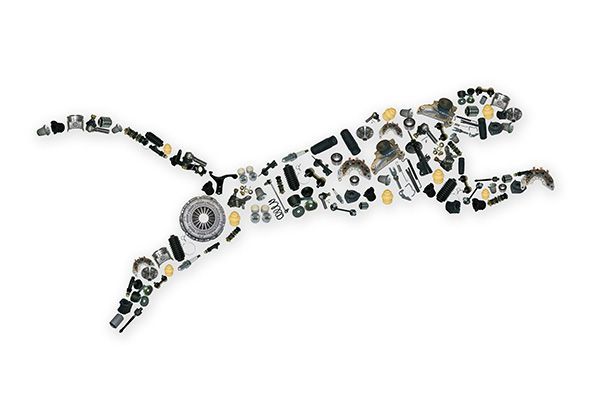 Abstract black-and-white leaping animal made of many small circular and geometric pieces | Jeff's Automotive, Inc