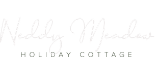 Logo reading “Neddy Meadow Holiday Cottage” in light gray script and serif text on a white background