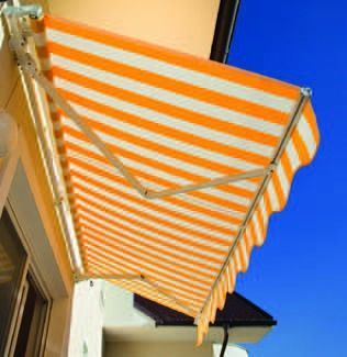 Orange-and-white striped awning extending over a building against a blue sky