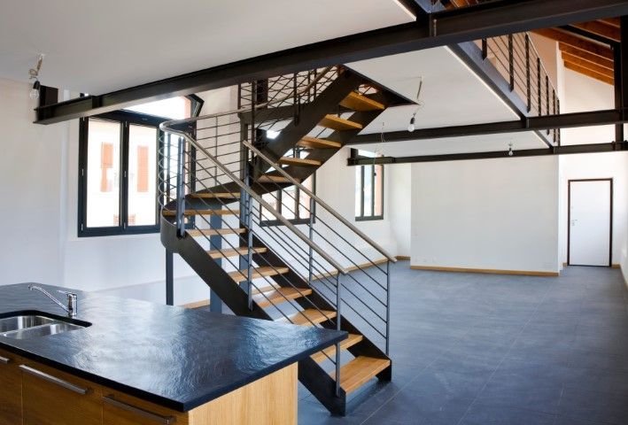 Kitchen design featuring steel-stringer floating stairs