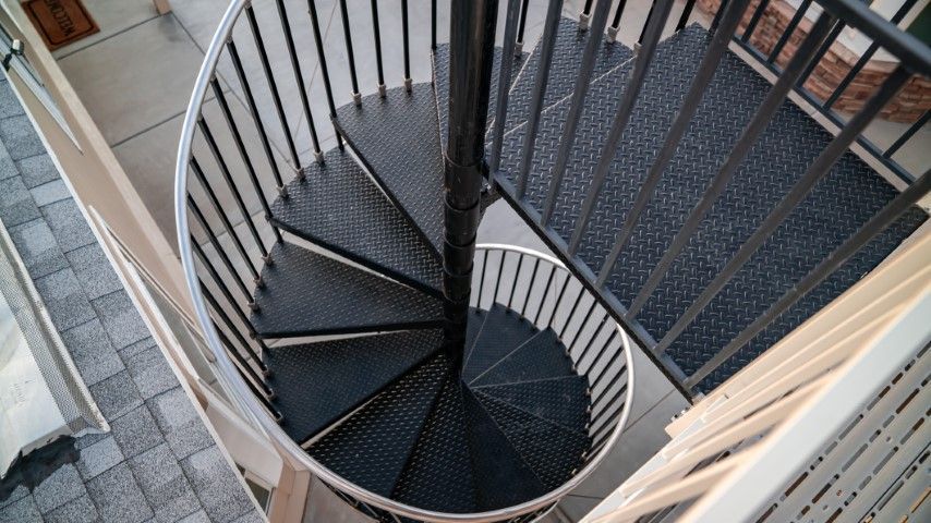 Elegant black spiral staircase to second level