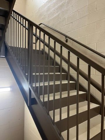 Elegant black spiral staircase to second level