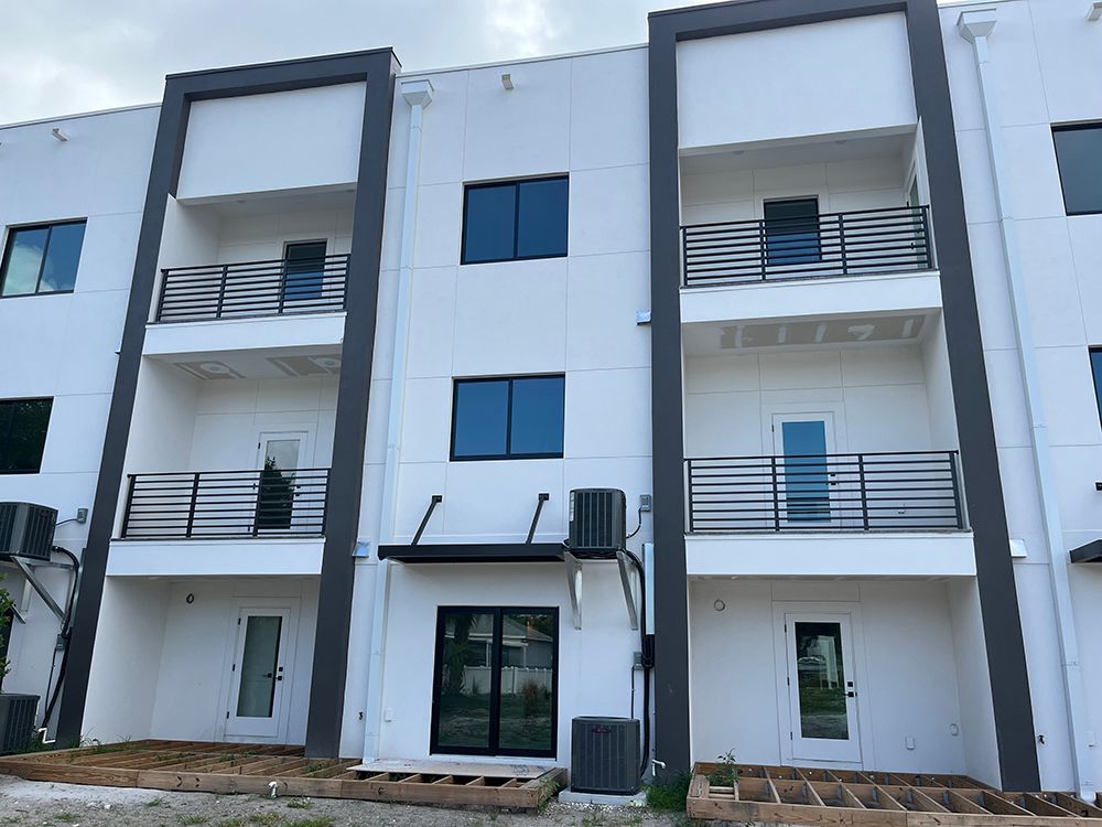 town home project with balcony railings and awnings