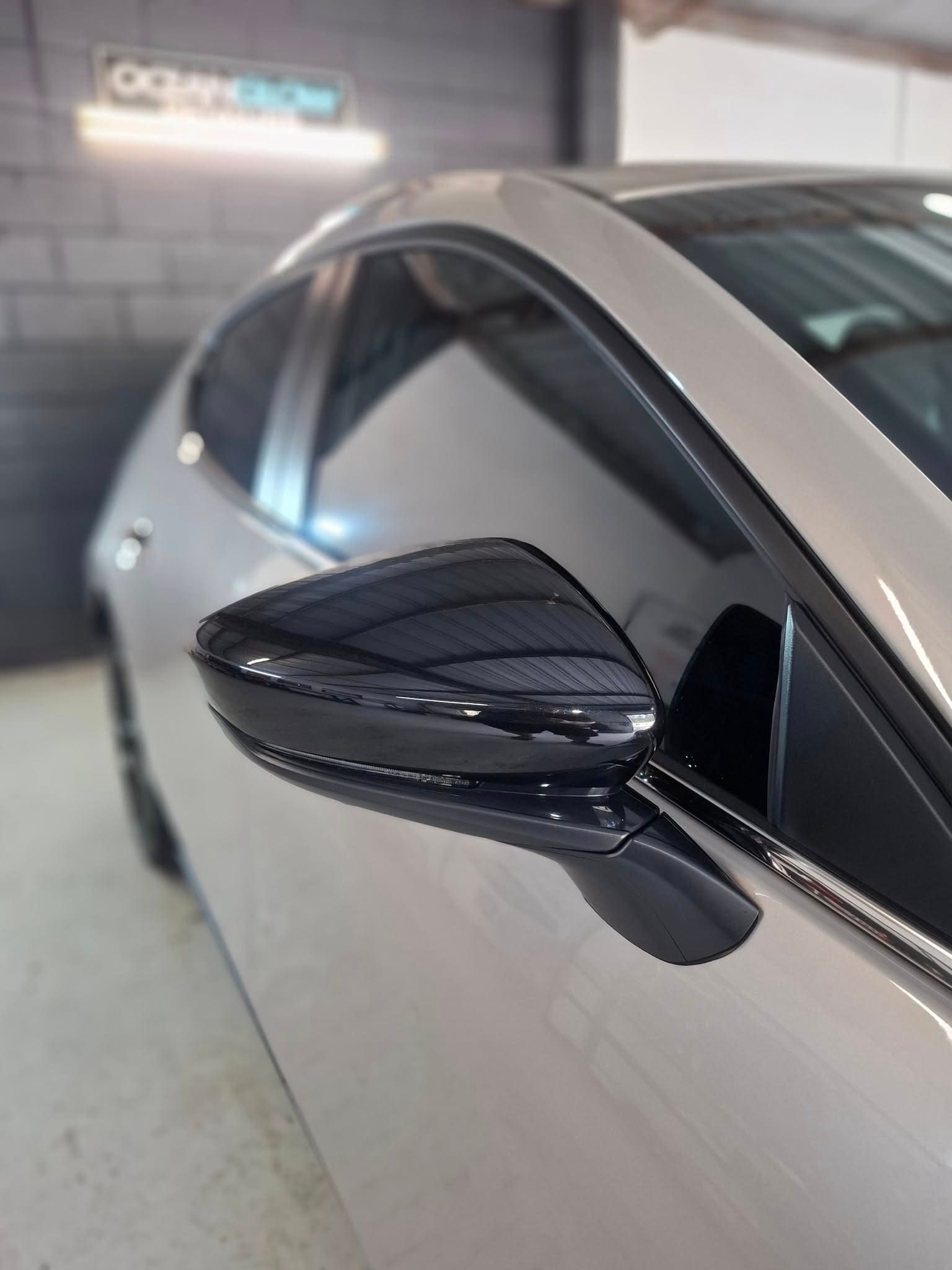 A Close up Of a Car 's Side Mirror in A Garage — Ocean Glow Mobile Detailing In Lake Macquarie, NSW