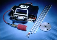 Portable metalworking tool kit with red-handled tool, two rods, and circular metal disk on blue background