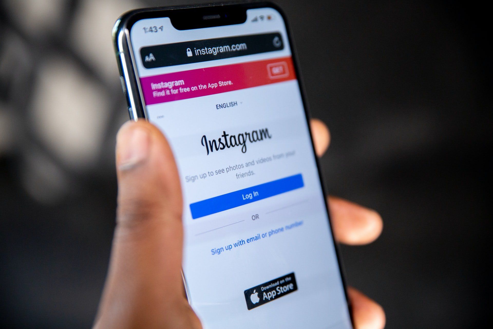 a person holding a smartphone with instagram on it