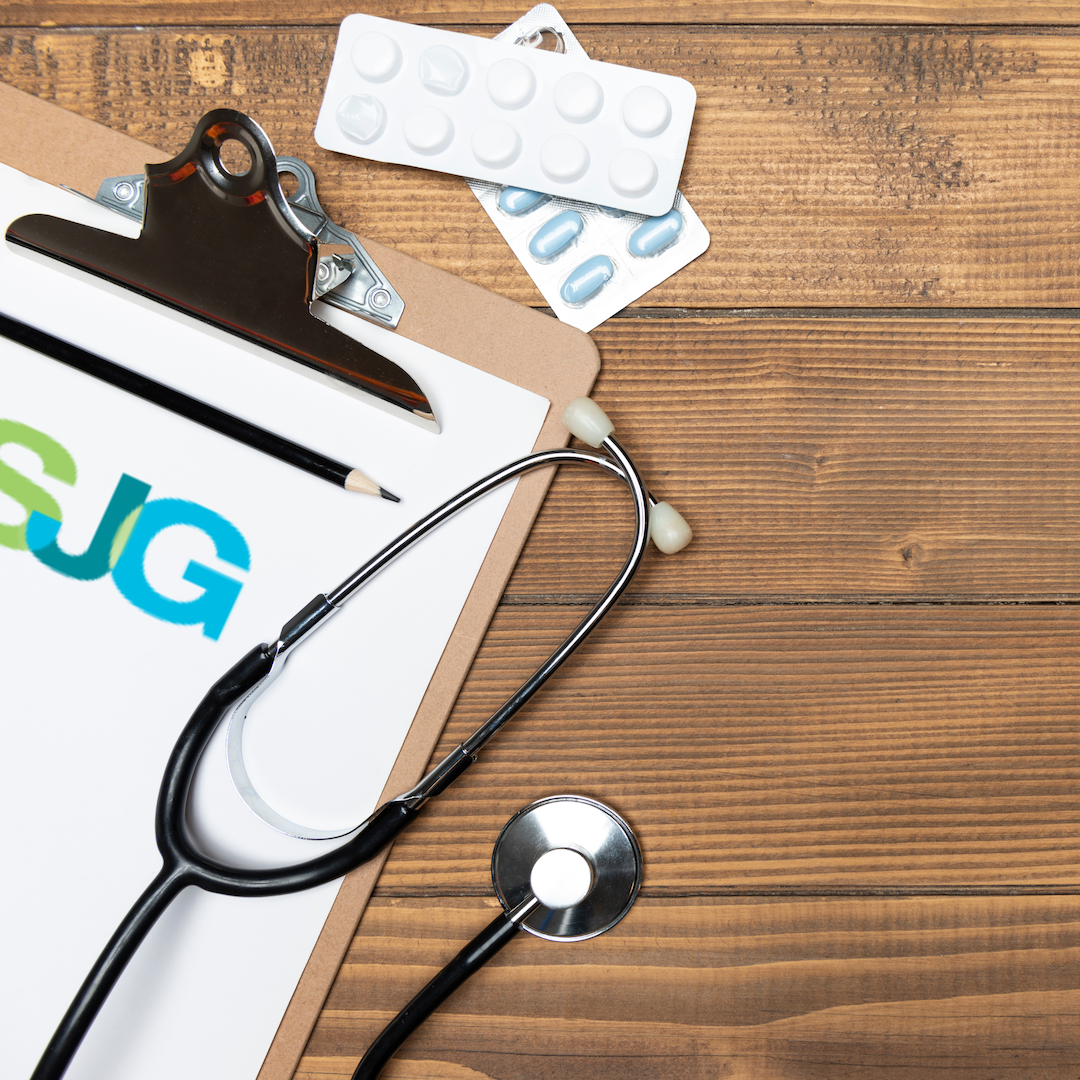 A clipboard with the word sjg on it