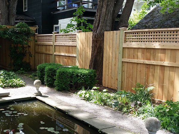 Wood Fence And A Tree | Auburn, NY | Connor Fence Co