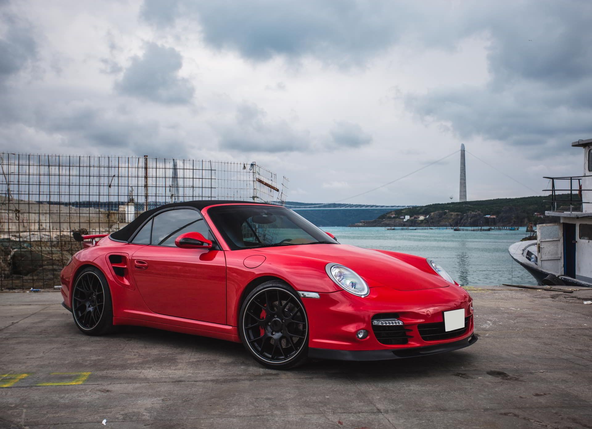 Ceramic Coating - A red porsche 911 turbo convertible.