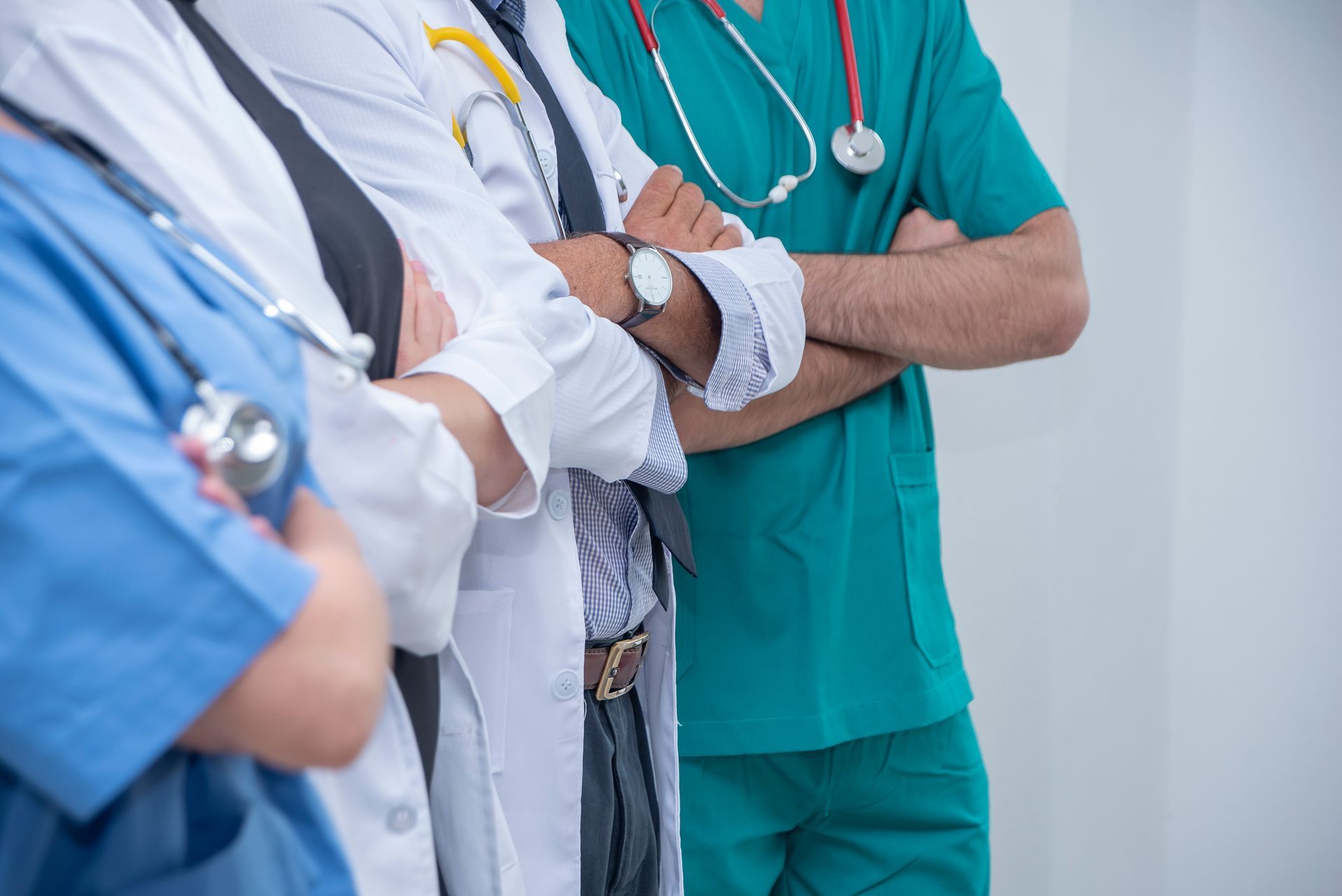 doctors standing with their arms crossed