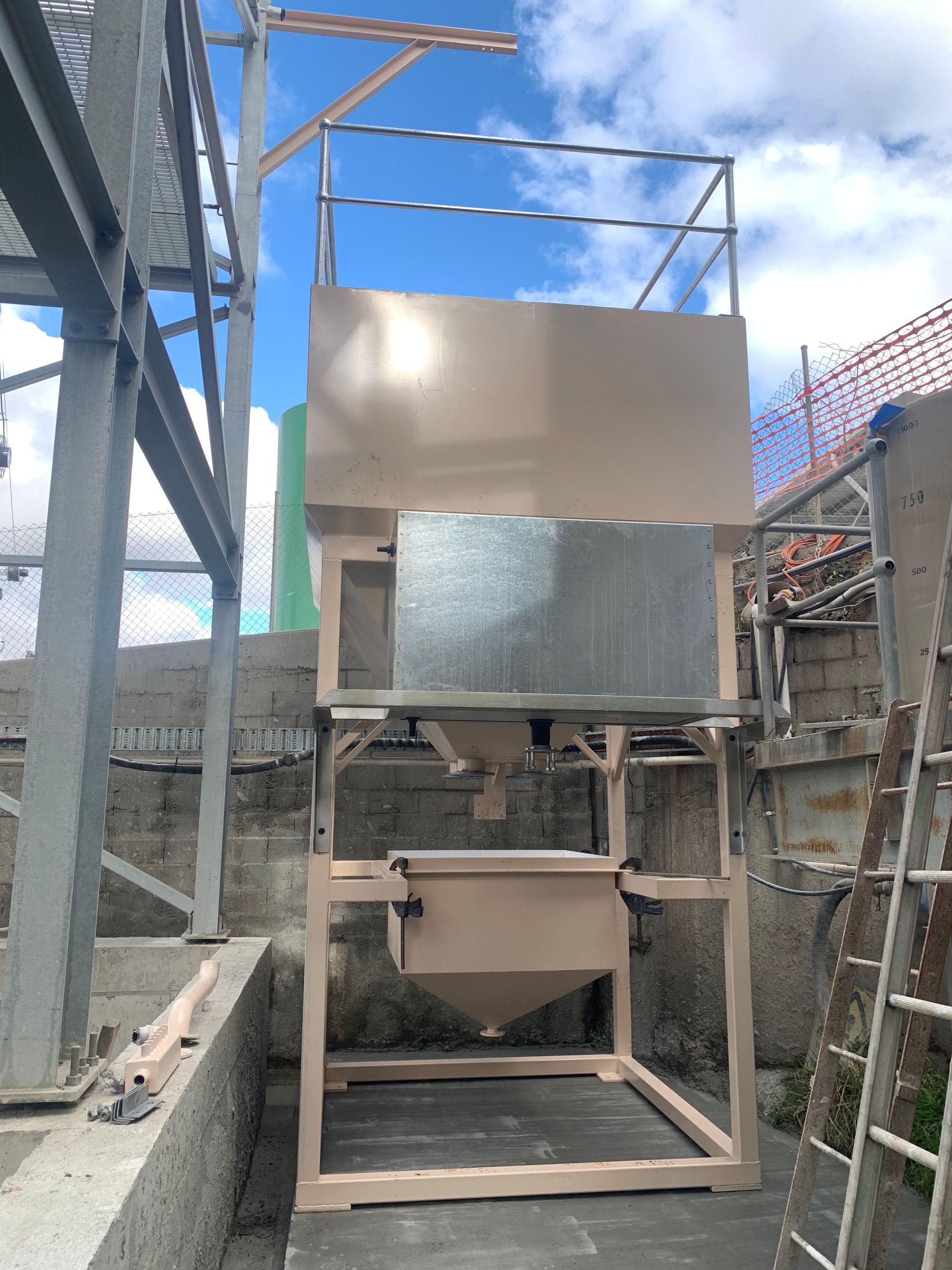 A large machine is sitting outside of a building next to a ladder — Magnum Steel In Crestwood, NSW