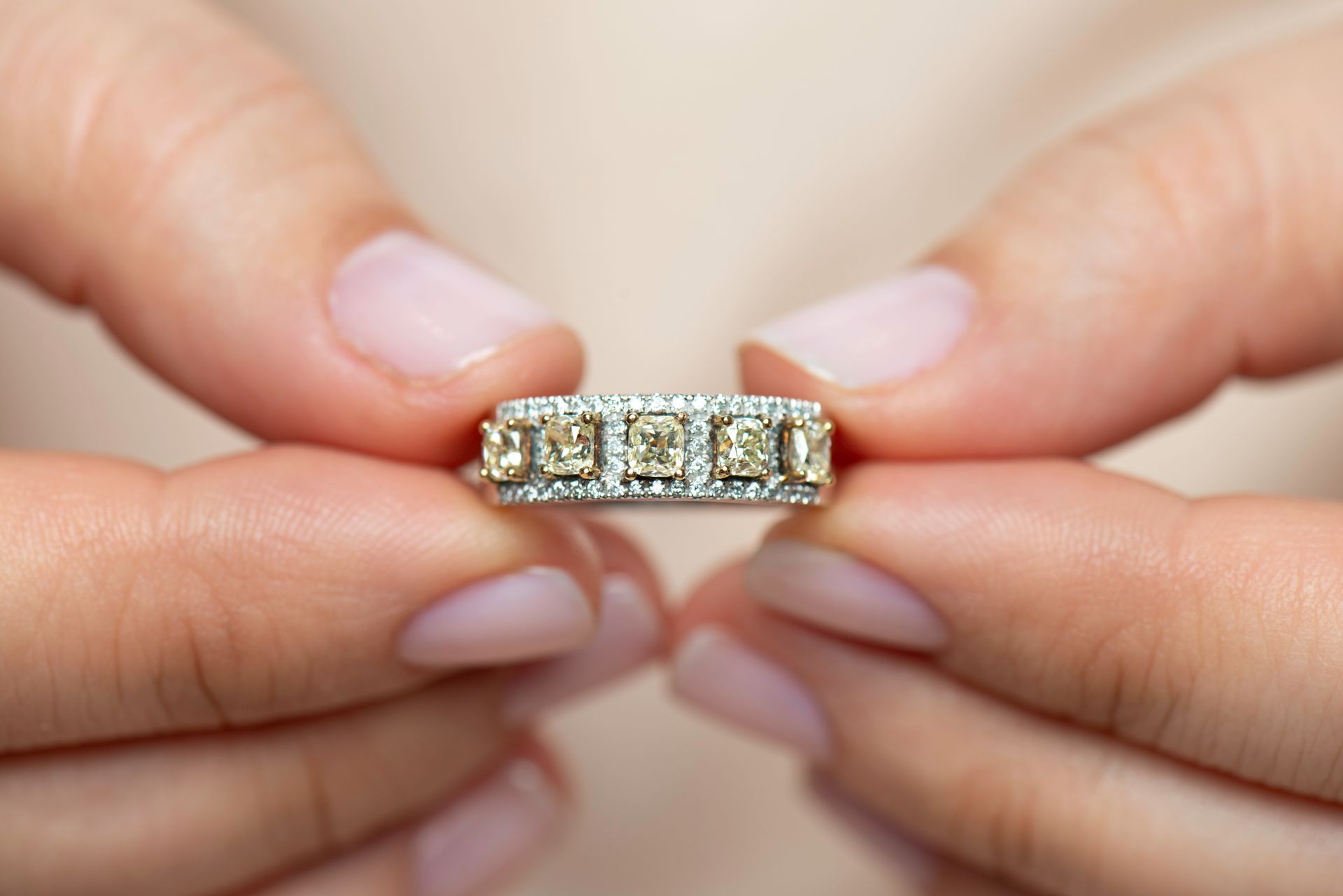 Woman Holding a Diamond Ring — Russellville, AL — Artistic Jewelry and Repair Woman Holding a Diamond Ring — Russellville, AL — Artistic Jewelry and Repair