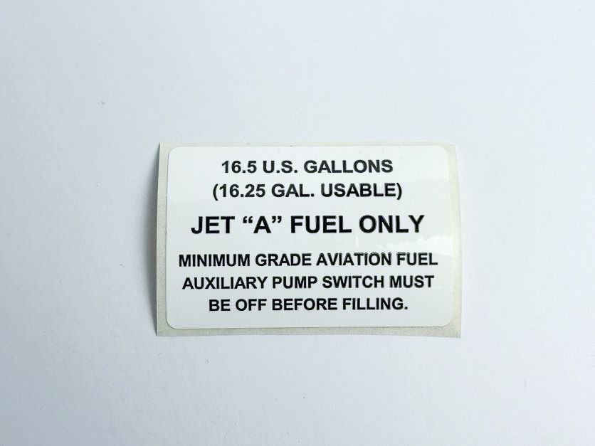 White sticker with text:
