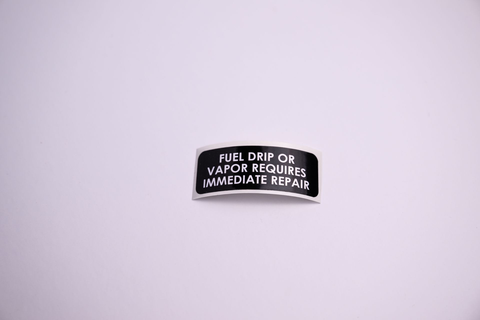 Black and white sticker with the text:
