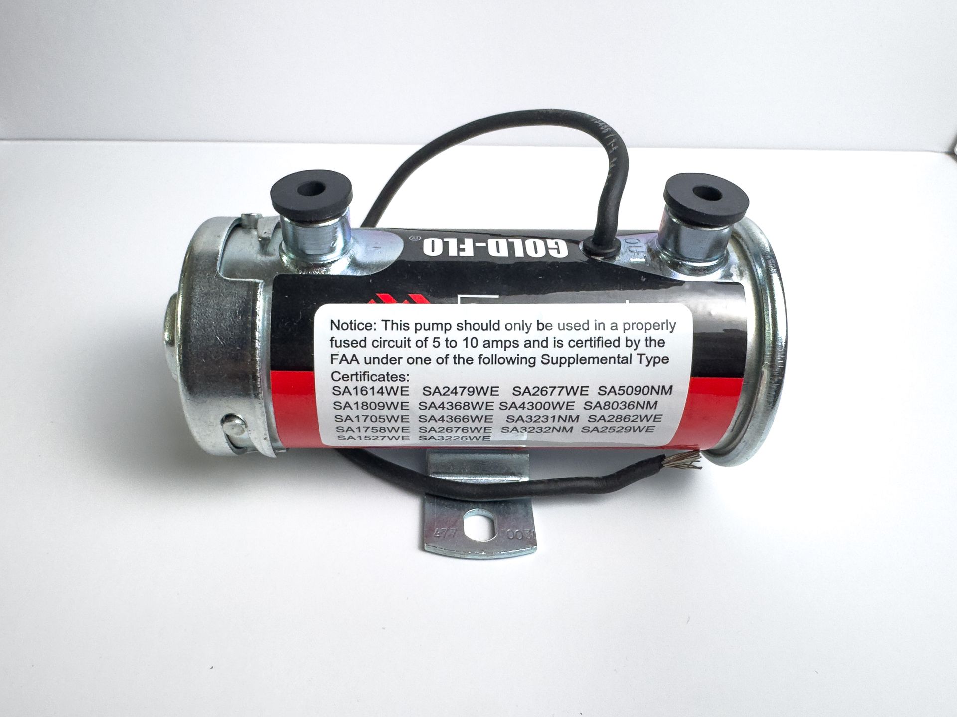 Fuel pump with black wiring, metal casing, and red and white label.