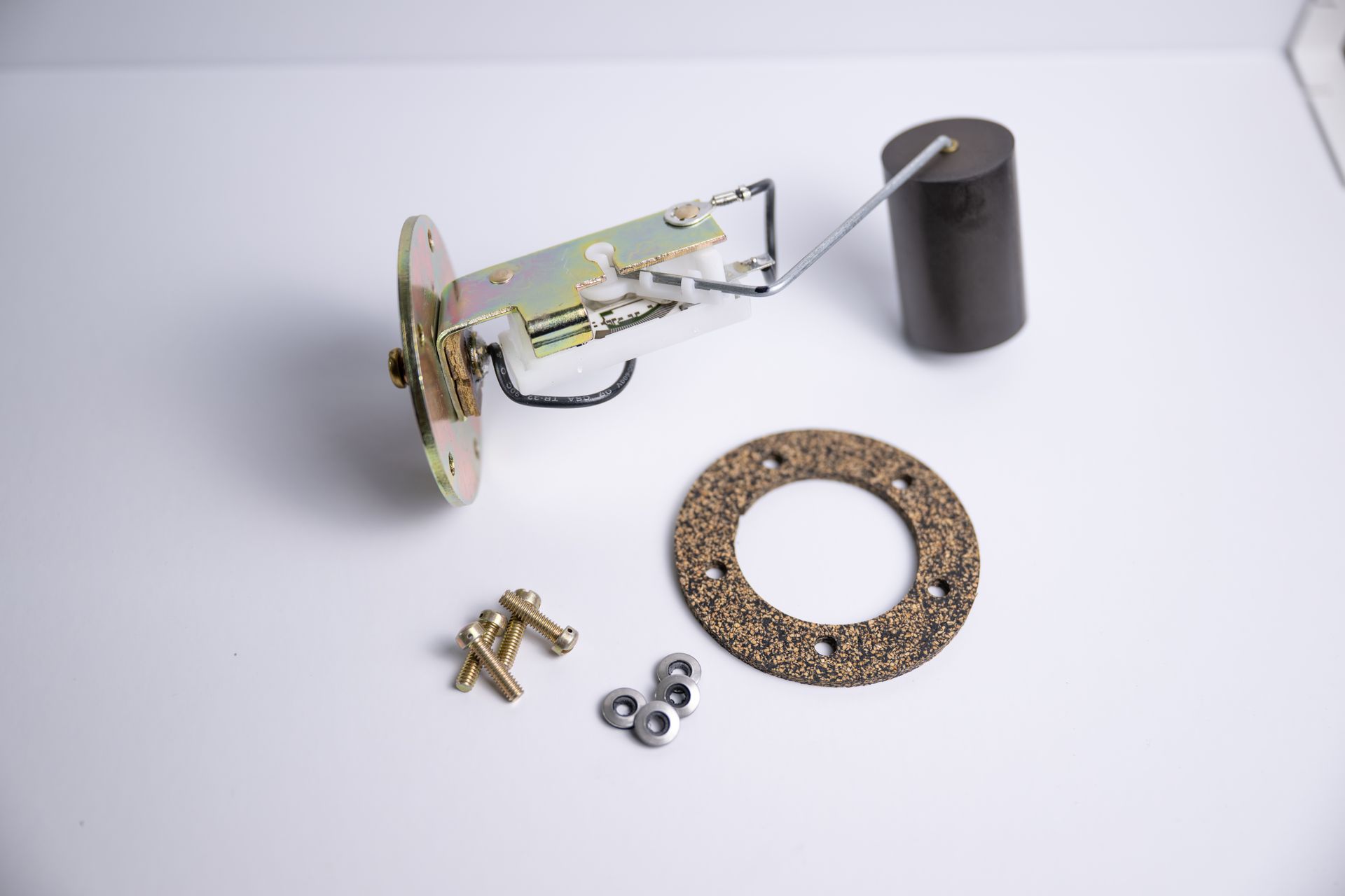 Fuel tank sending unit assembly with gasket, screws, and nuts.