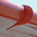 Red stall fence on a plane wing.