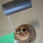 Fuel tank sending unit with a float and a cylindrical component.