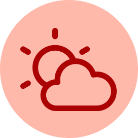 A red circular icon featuring a central circle surrounded by eight short, evenly spaced radiating lines, representing a sun.