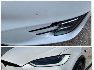 Close-up of white car front bumper and headlight with black trim.