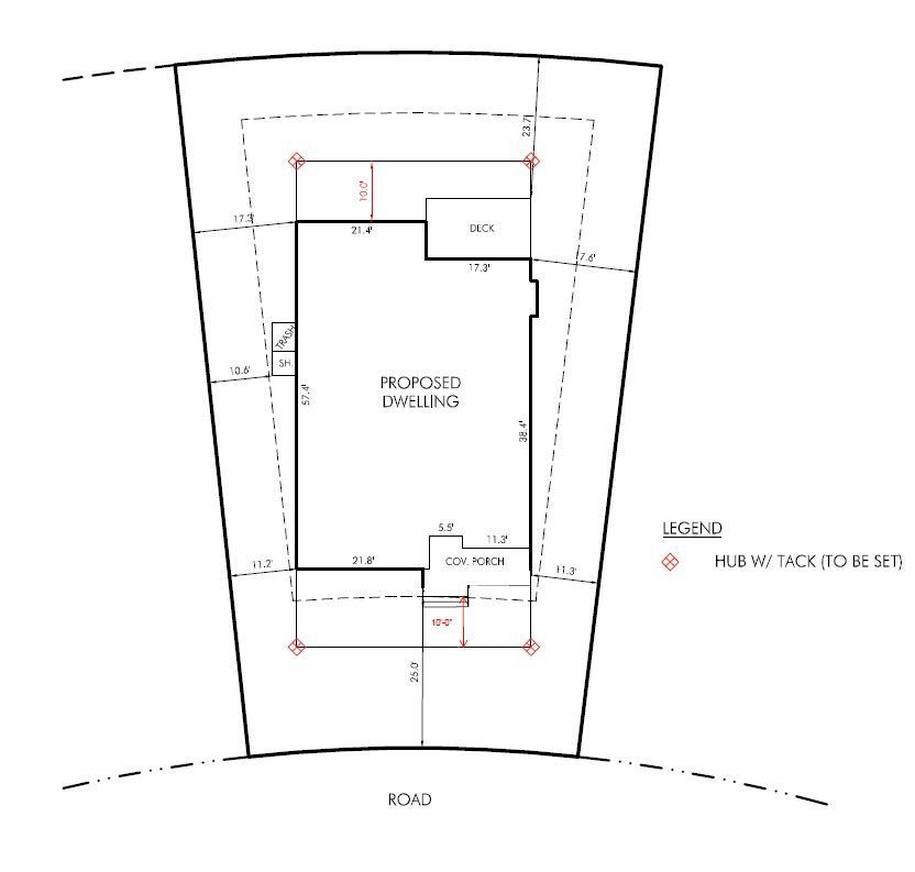 Site plan showing a proposed building footprint on a road frontage parcel with setback dimensions.