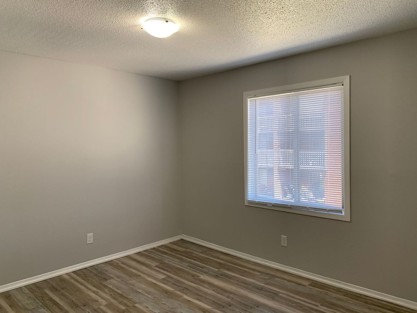 there is a large window in the middle of the room .
