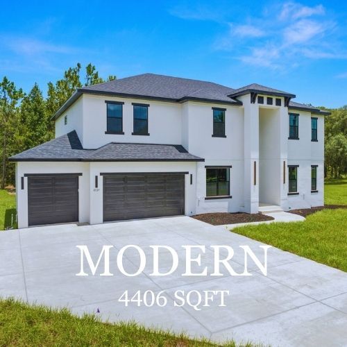 Modern white house with gray garage doors and a long driveway; 4406 sqft.