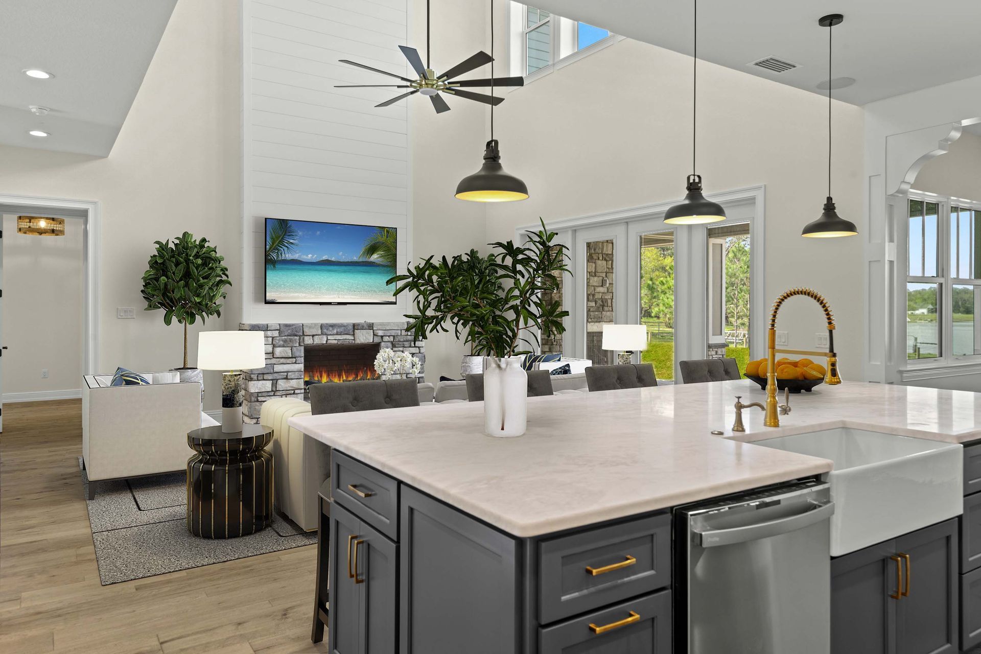 Modern kitchen and living room with island, fireplace, and large windows.