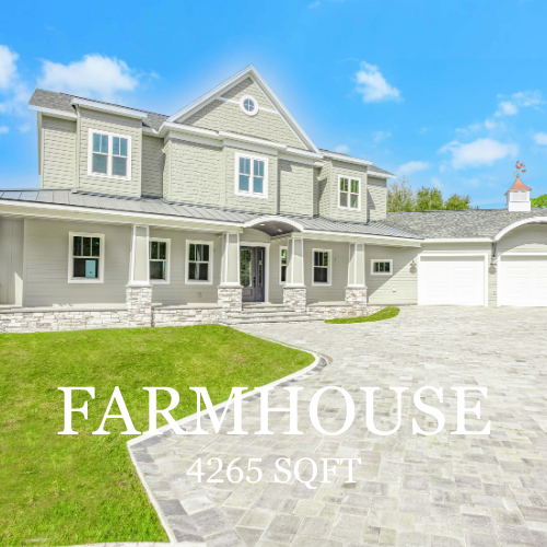 Gray farmhouse with stone accents, a two-car garage, and a brick driveway on a sunny day. 4265 sq ft.