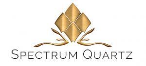 The logo for spectrum quartz is a gold diamond with a ribbon around it.