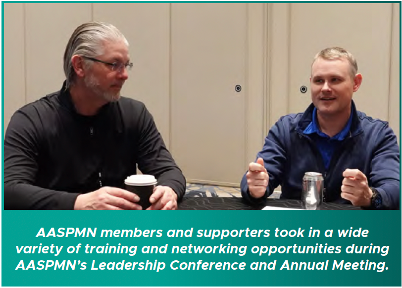 Two men speaking at AASPMN Leadership Conference and Annual Meeting with caption banner below