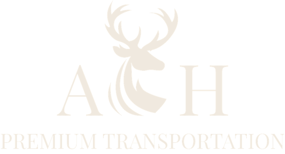 Silhouette of a deer head with large antlers in navy blue, accented with curved lines.