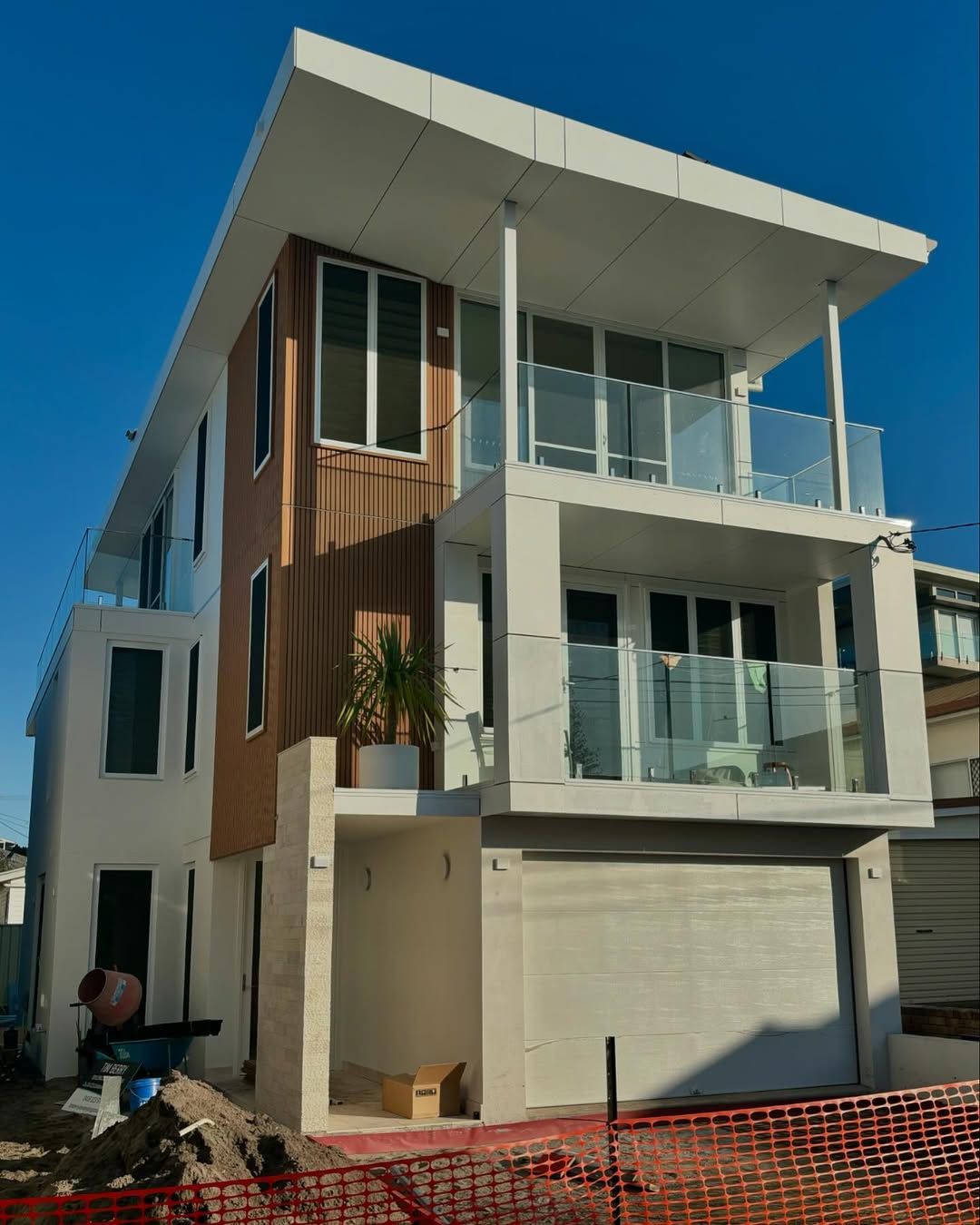 A Three Story House and Blue Sky — Shawline Plumbing and Drainage In Iluka, NSW
