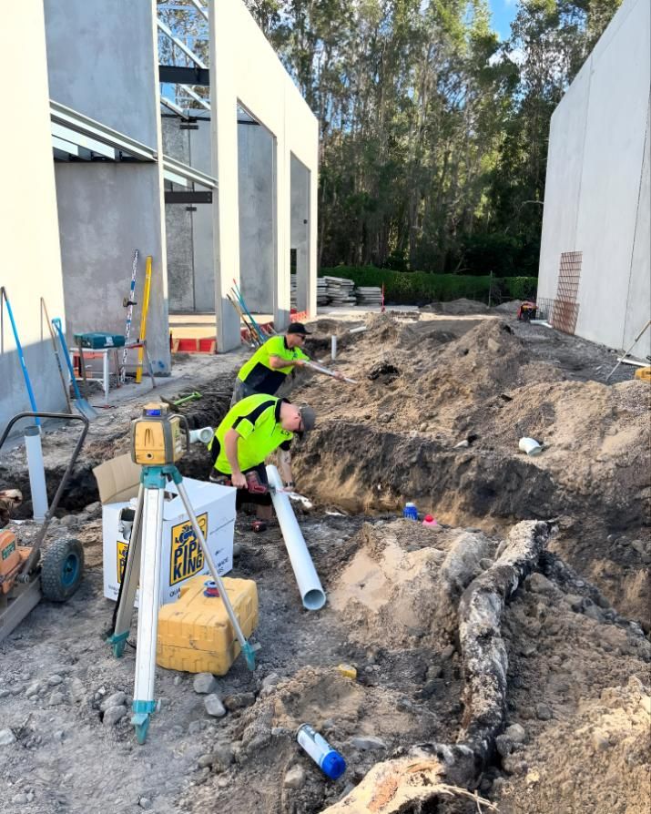 A Group of Construction Workers Are Working on a Construction Site — Shawline Plumbing and Drainage In Iluka, NSW