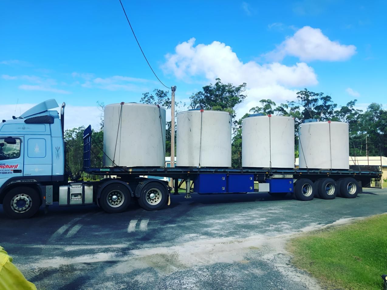 A Truck is Carrying Concrete Cylinders on a Trailer — Shawline Plumbing and Drainage In Iluka, NSW