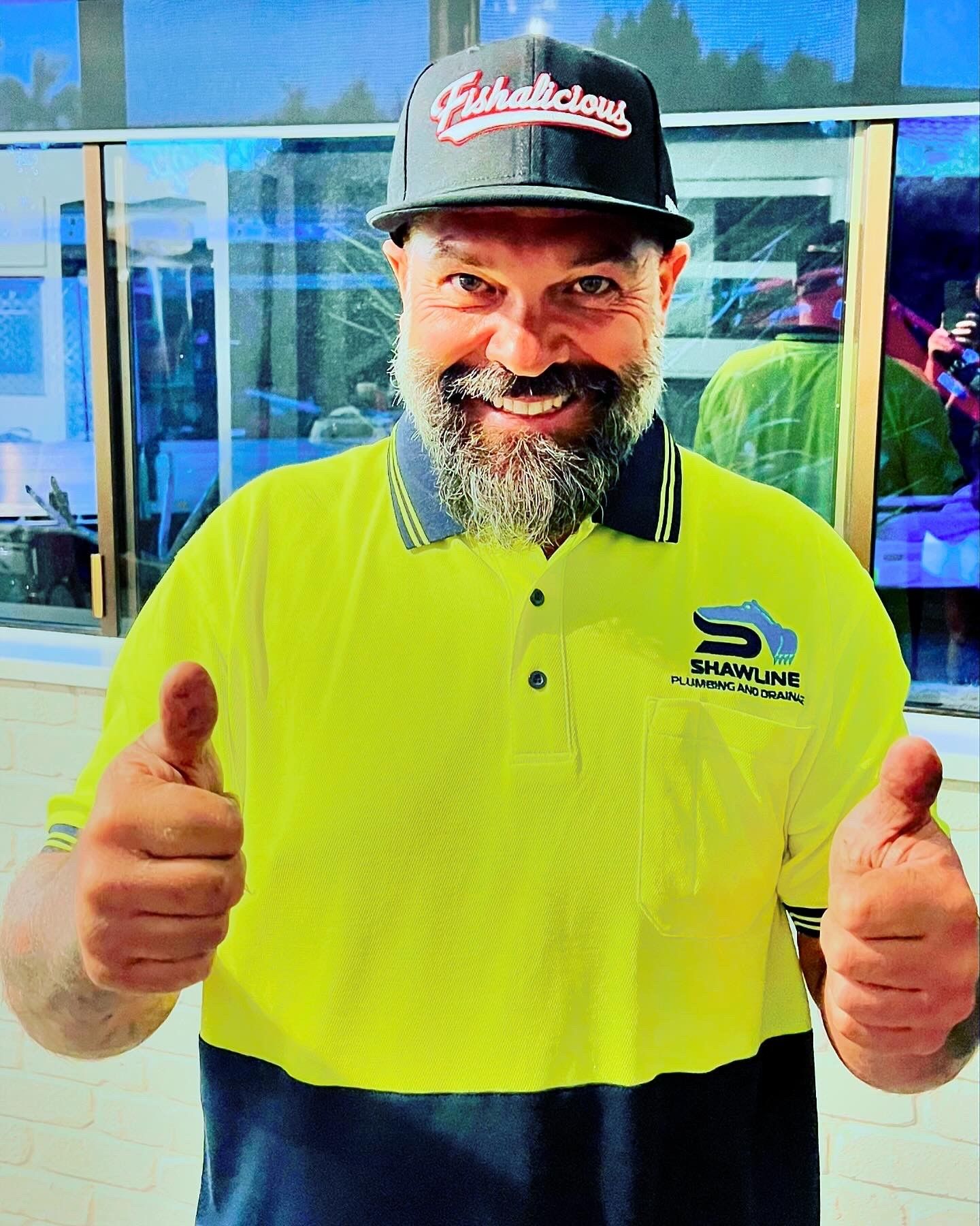 A Man Standing with his thumbs up in a yellow shirt — Shawline Plumbing and Drainage In Iluka, NSW