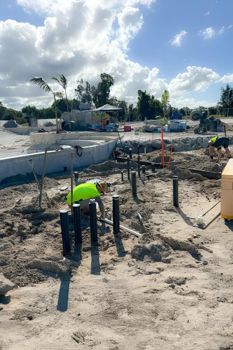 A Man in a Yellow Vest is Working in the Dirt — Shawline Plumbing and Drainage In Iluka, NSW