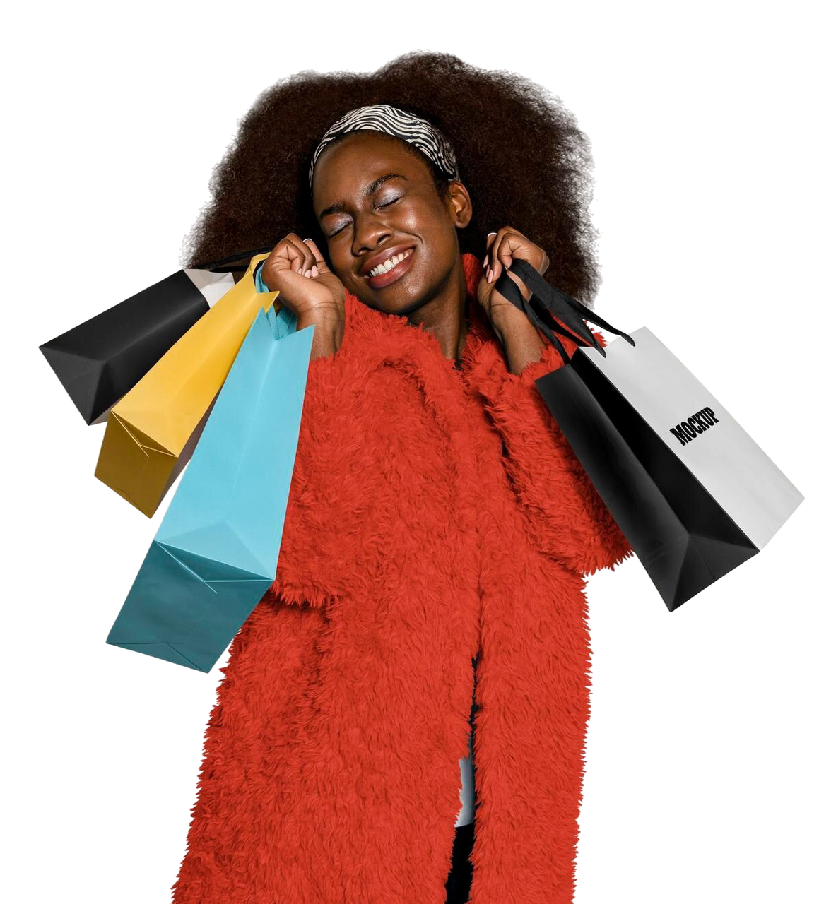 Woman holding shopping bags, smiling and wearing a red coat.