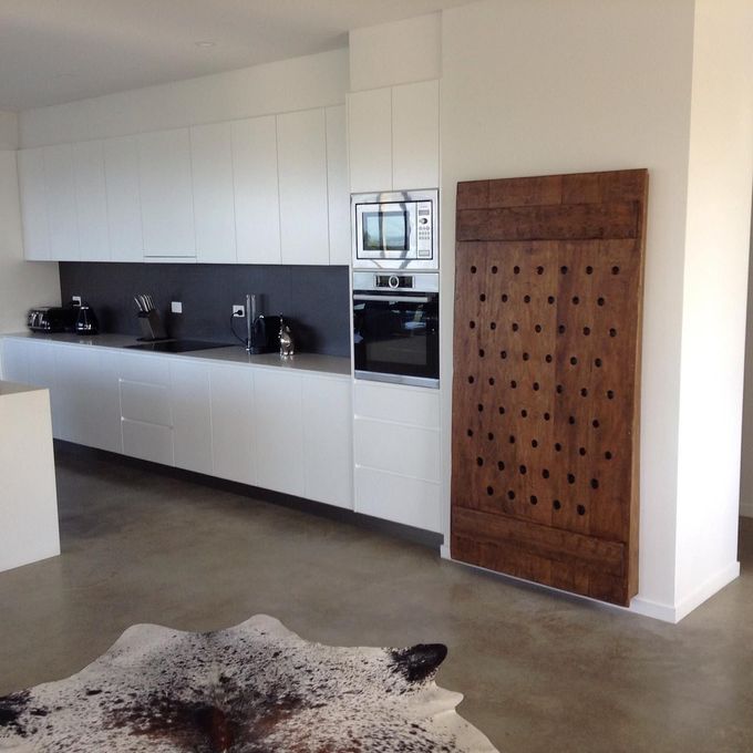 A Kitchen With a Cowhide Rug on the Floor — Simonetto'S Cabinets & Joinery in Nambour, QLD