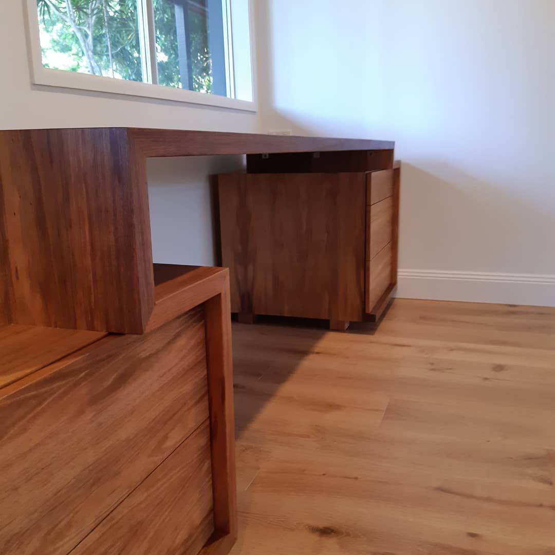 A Wooden Desk in A Room Next to A Window — Simonetto'S Cabinets & Joinery in Noosa, QLD