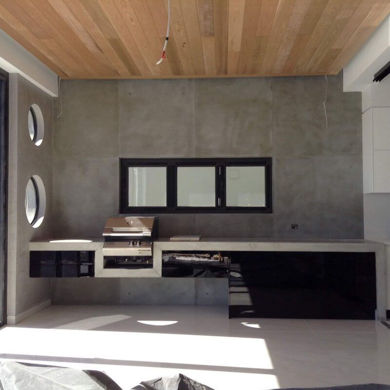 A Kitchen with A Wooden Ceiling and Black Cabinets — Simonetto'S Cabinets & Joinery in Nambour, QLD