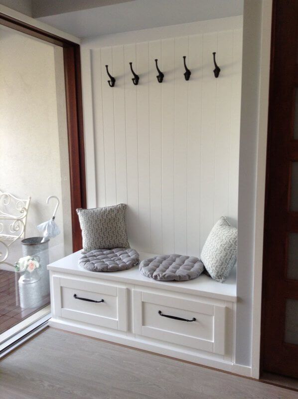 A White Bench with Drawers Underneath It and Hooks on The Wall — Simonetto'S Cabinets & Joinery in Nambour, QLD