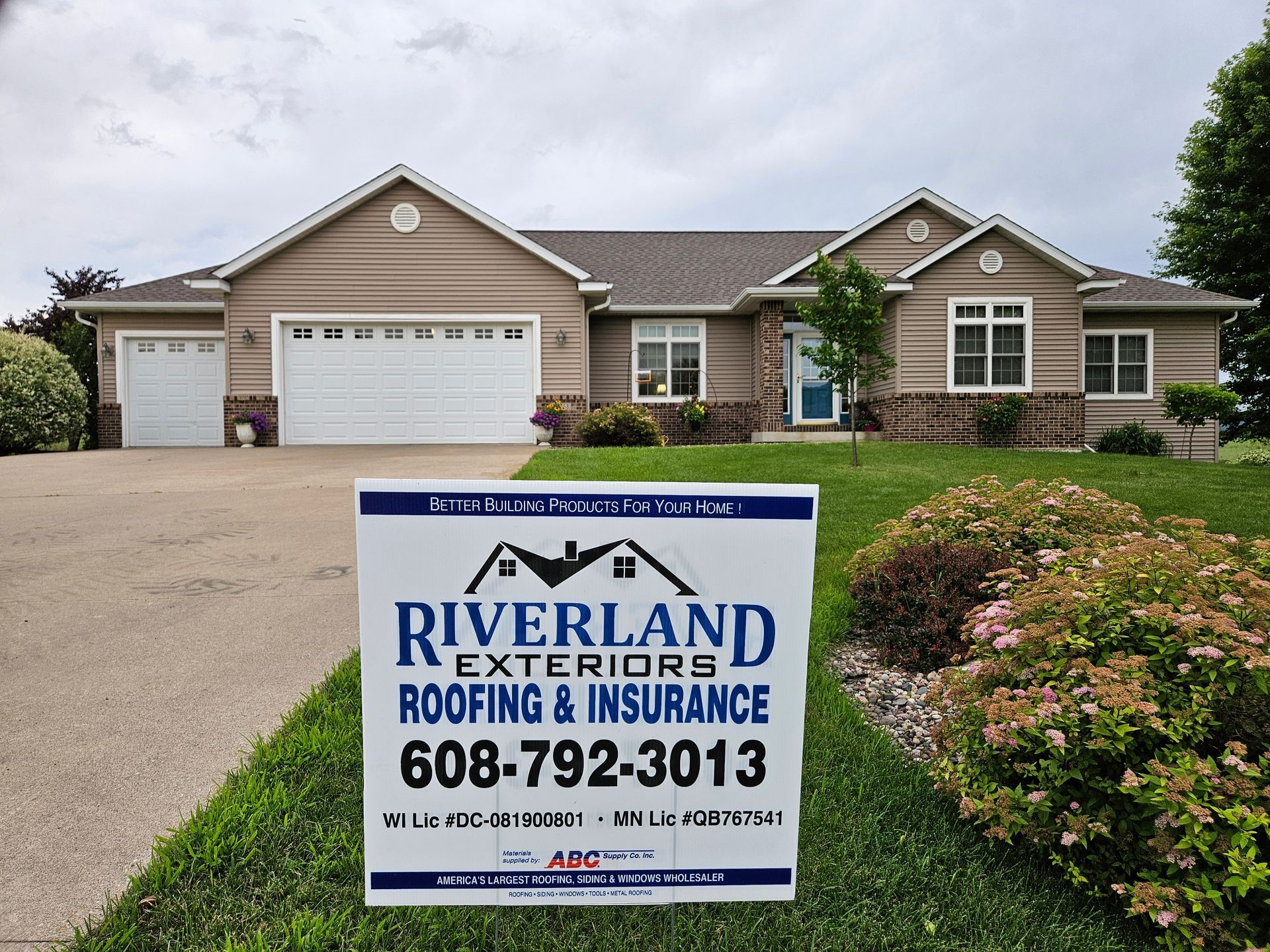Sign in front of a house advertising 