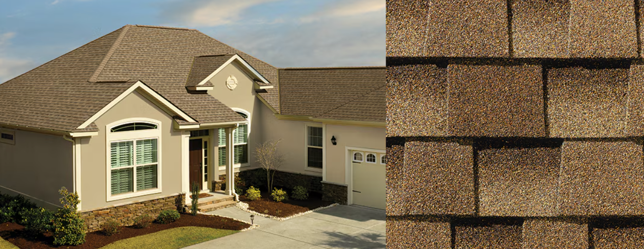A house with a brown roof and matching shingle detail.